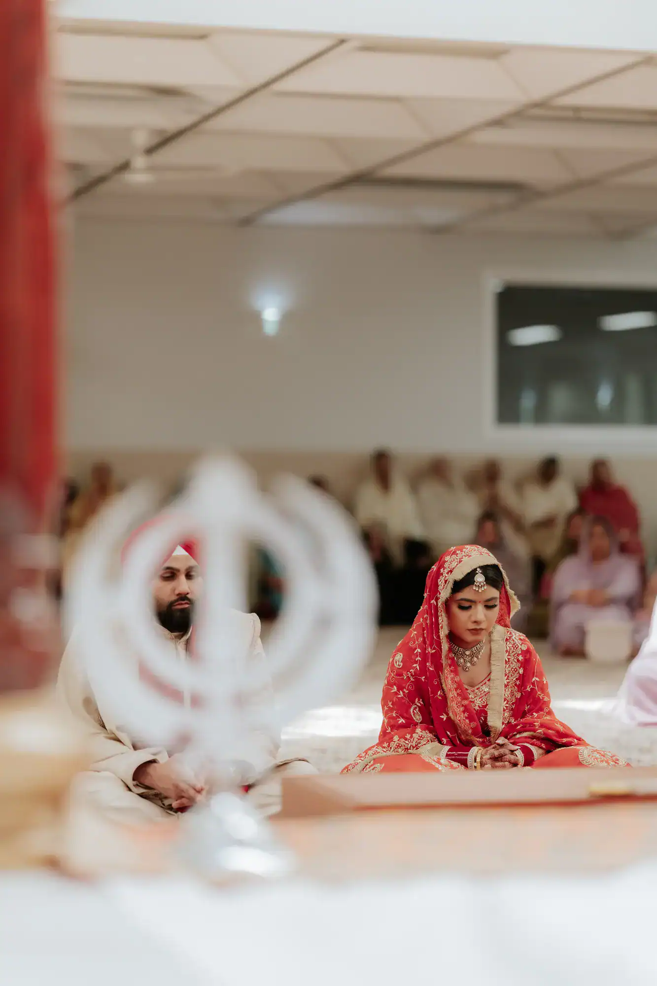 Couple seated together during a wedding ceremony